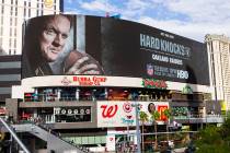 A digital billboard displays Oakland Raiders coach Jon Gruden in an advertisement for the upcom ...