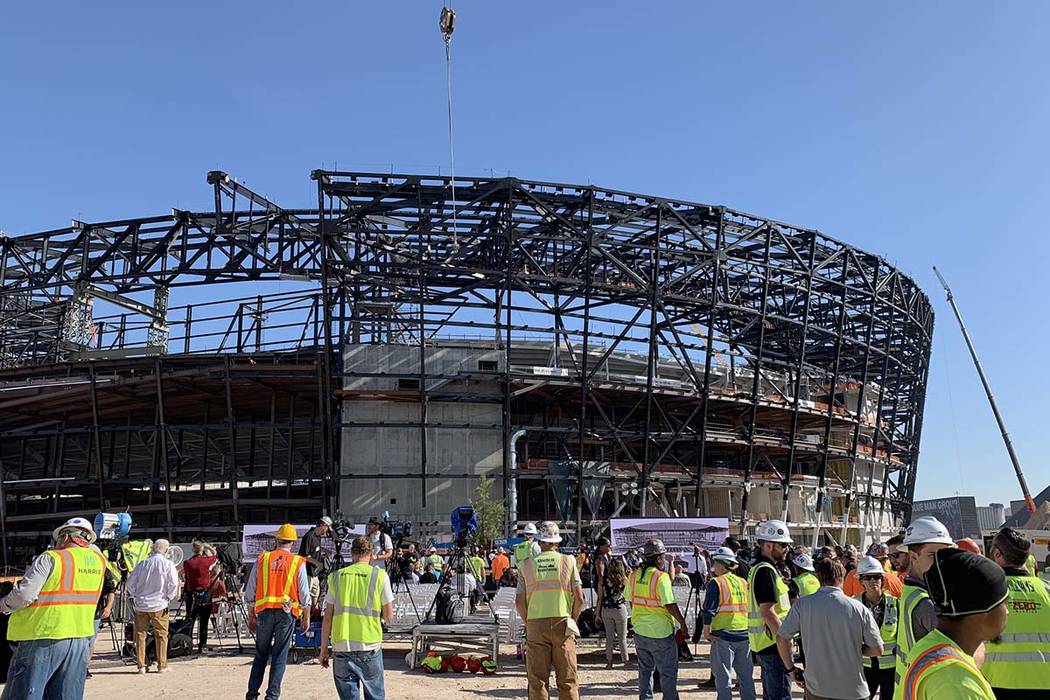 Dignitaries and construction workers take part in a topping out ceremony at Las Vegas Stadium, ...