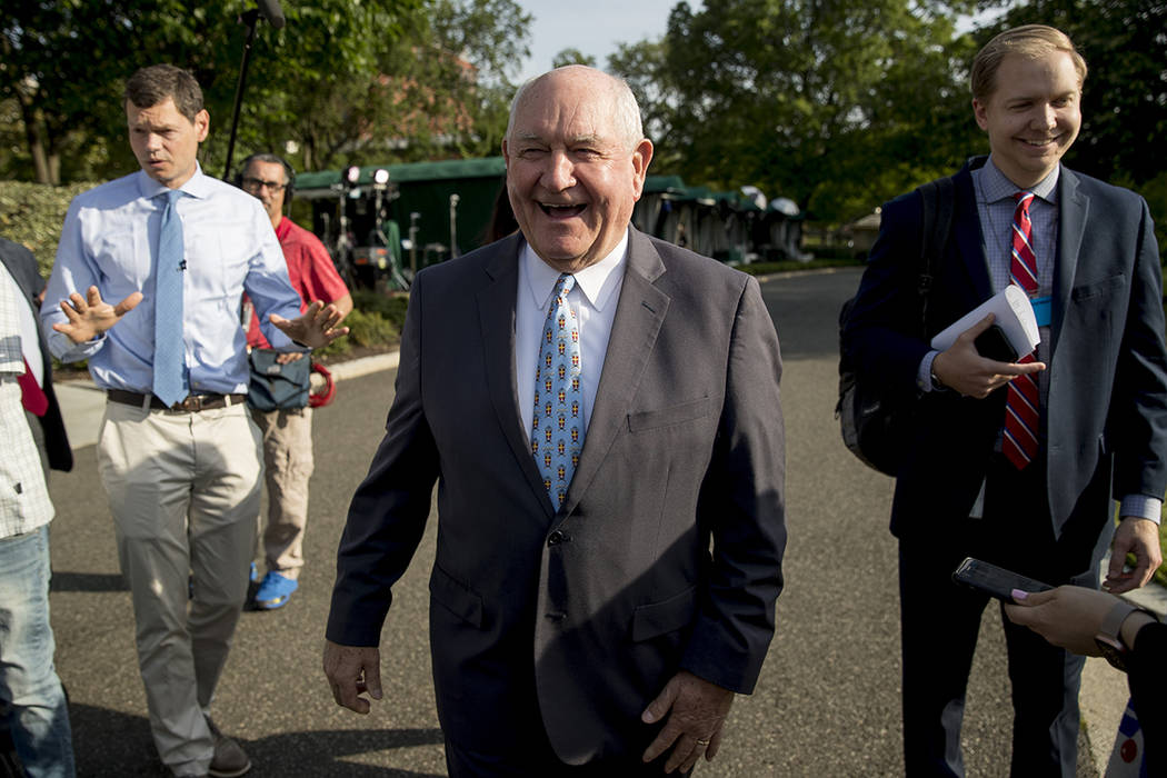 FILE--Agriculture Secretary Sonny Perdue laughs with a reporter on the North Lawn of the White ...