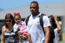 Oakland Raiders safety Johnathan Abram carries his daughter Harlee, 2, after a joint NFL traini ...