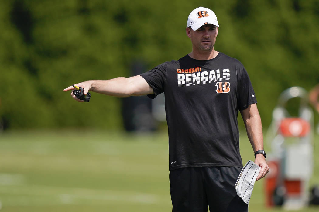 Cincinnati Bengals head coach Zac Taylor directs players during NFL football training camp, Sun ...