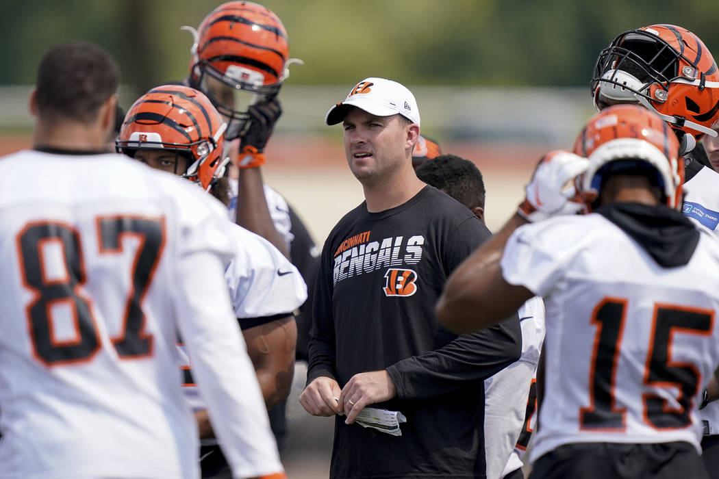 Cincinnati Bengals head coach Zac Taylor talks his players during the first day of NFL football ...