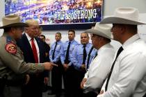 President Donald Trump speaks to first responders as he visits the El Paso Regional Communicati ...
