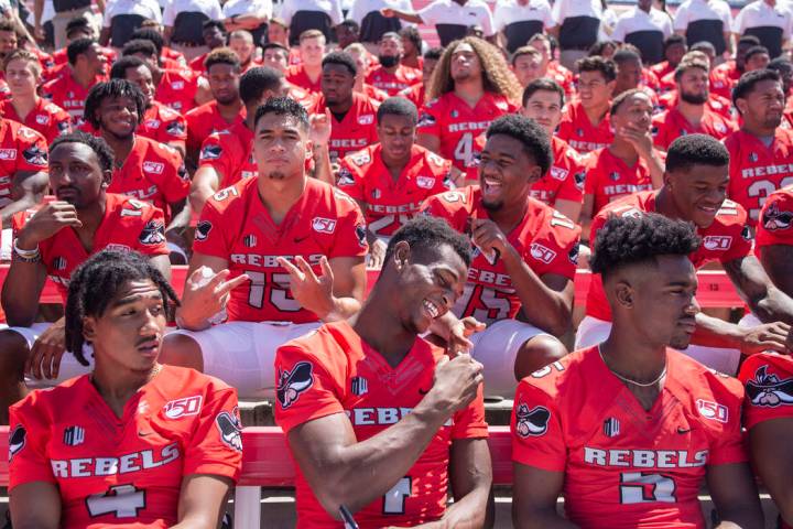 UNLV football players get into place during the team's photo day at Sam Boyd Stadium in Las Veg ...