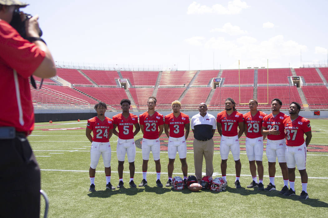 UNLV football players get into place during the team's photo day at Sam Boyd Stadium in Las Veg ...