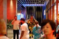 In this Monday, Aug. 5, 2019, photo, a firefighter walks out of the Waikiki Beachcomber by Outr ...