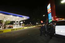 Garden Grove police stand watch at the scene of a stabbing in Garden Grove, Calif., Wednesday, ...