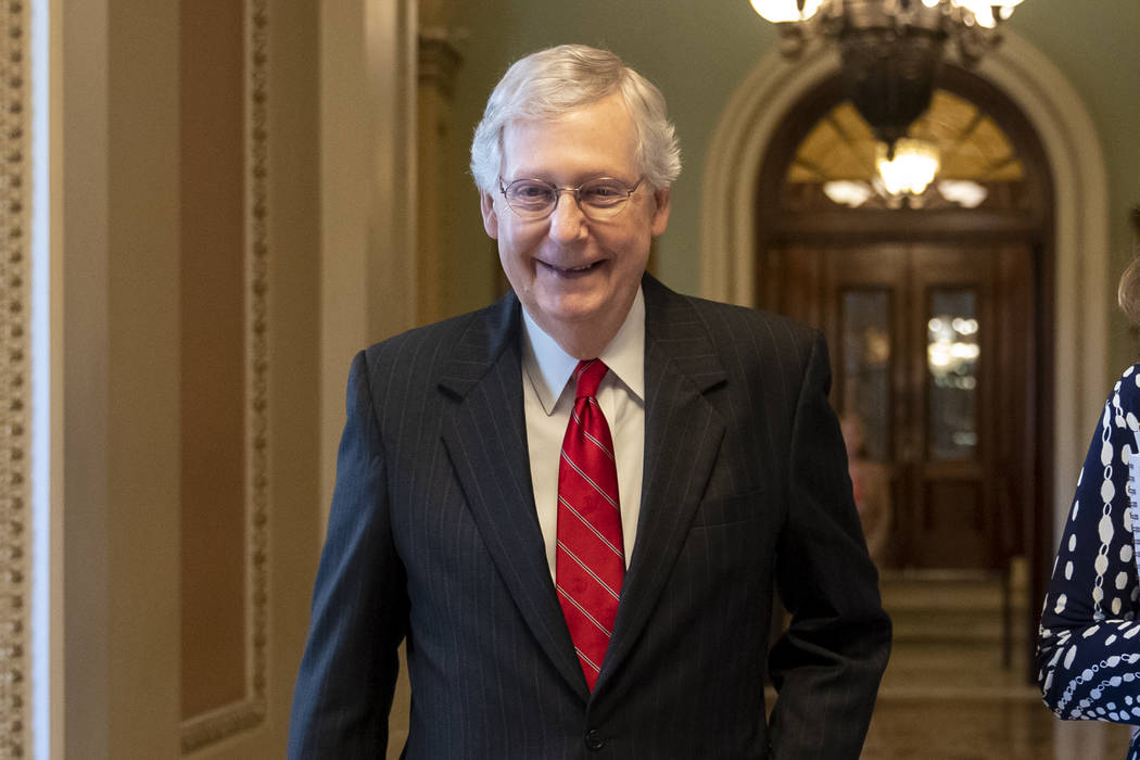 Senate Majority Leader Mitch McConnell, R-Ky., smiles after vote on a hard-won budget deal that ...