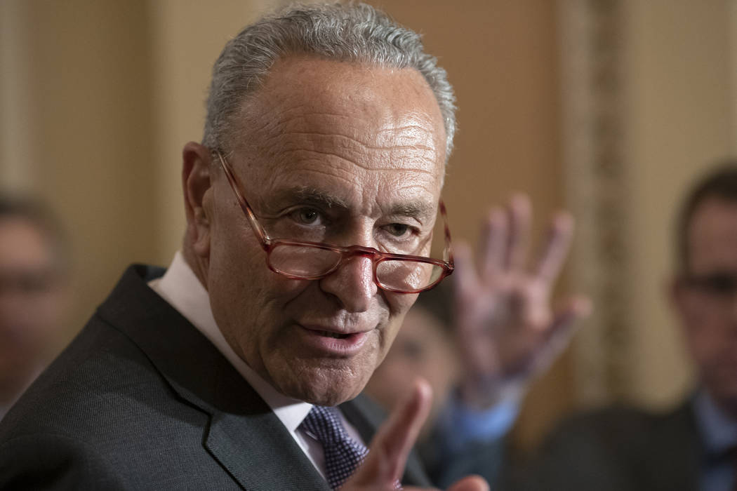 FILE - In this July 30, 2019, photo, Senate Minority Leader Chuck Schumer, D-N.Y., takes questi ...