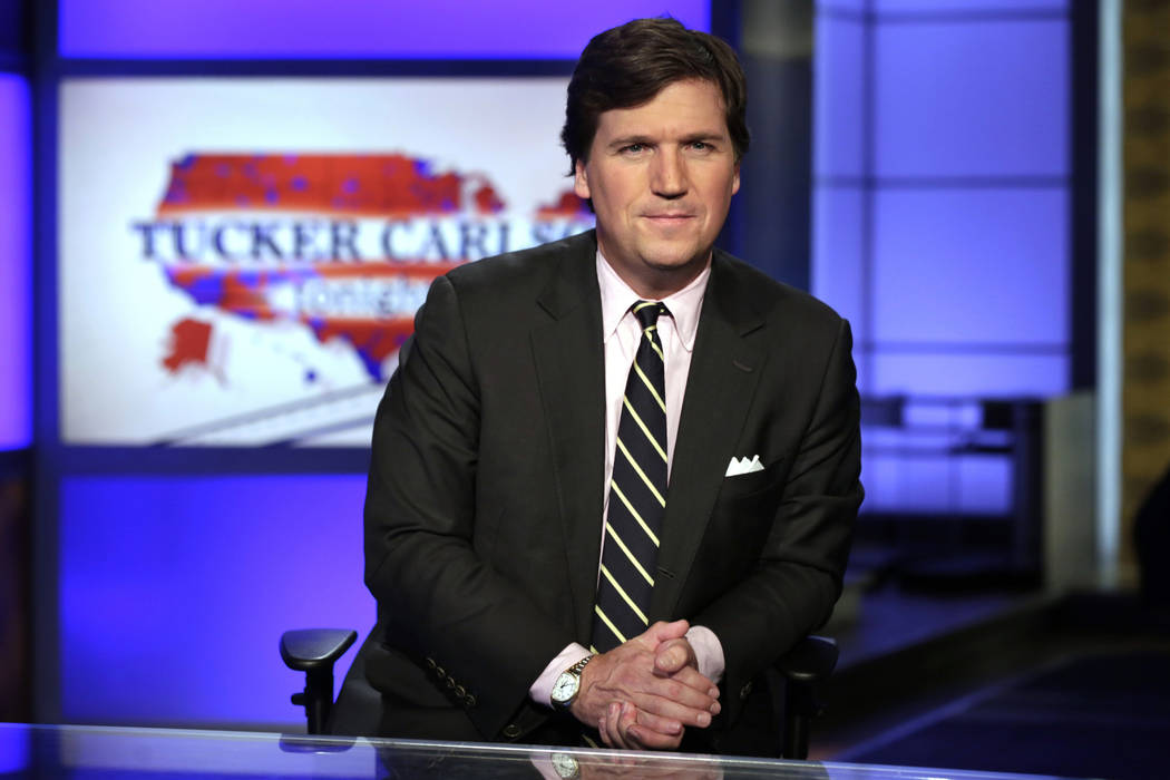 In this March 2, 2017 file photo, Tucker Carlson, host of "Tucker Carlson Tonight," poses for p ...