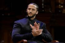 In this Oct. 11, 2018, file photo, former NFL football quarterback Colin Kaepernick applauds wh ...