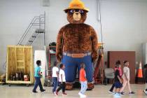 In an Oct. 11, 2017, file photo, a giant Smokey Bear statue greets children at the Fire Departm ...