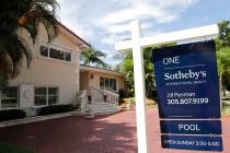 In a July 22, 2019, photo, a for sale sign is posted in front of a home in Miami. Mortgage buye ...