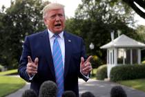 FILE - In this Aug. 2, 2019 file photo, President Donald Trump speaks to reporters before depar ...