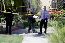 Police investigate the scene where two people were stabbed to death Thursday, Aug. 8, 2019, in ...