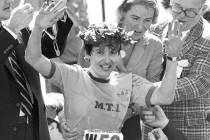 FILE - In this April 21, 1980 file photo, Rosie Ruiz waves to the crowd after after being annou ...