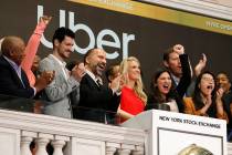 In a May 10, 2019, file photo Uber CEO Dara Khosrowshahi, third from left, attends the opening ...