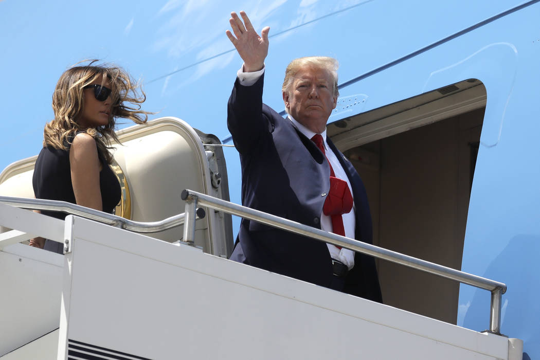 President Donald Trump and first lady Melania Trump board Air Force One at Wright-Patterson Air ...
