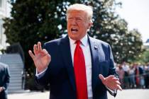 President Donald Trump talks to reporters on the South Lawn of the White House, Friday, Aug. 9, ...