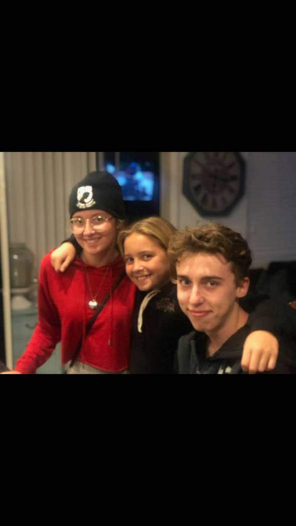Harlee Deborski poses with two of his siblings. The 19-year-old and his friend Timothy Bailey, ...