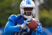 Detroit Lions tight end Brandon Barnes catches a pass during NFL football training camp in Alle ...