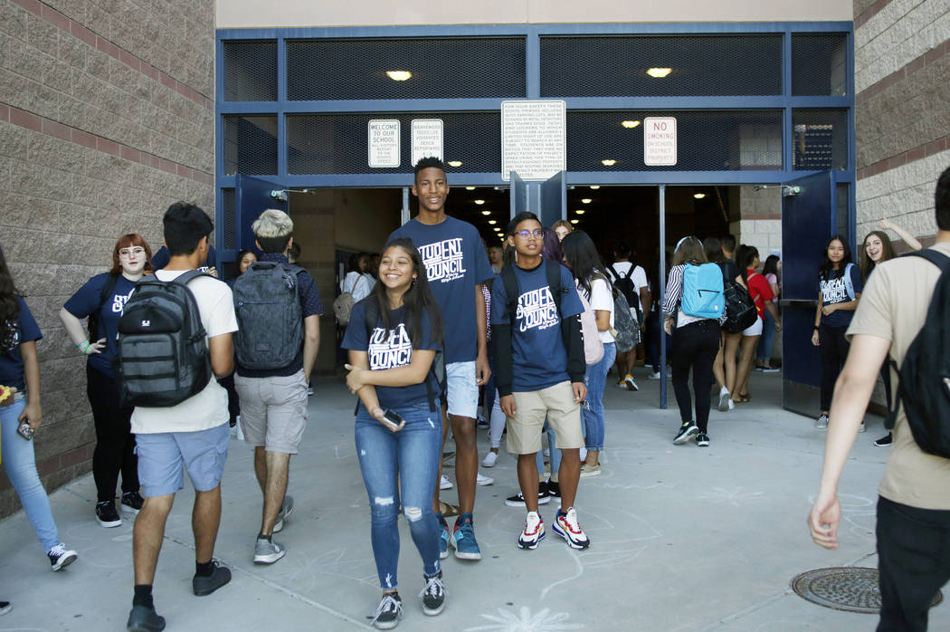 Student council members welcome fellow students on the first day of school at Liberty High Scho ...