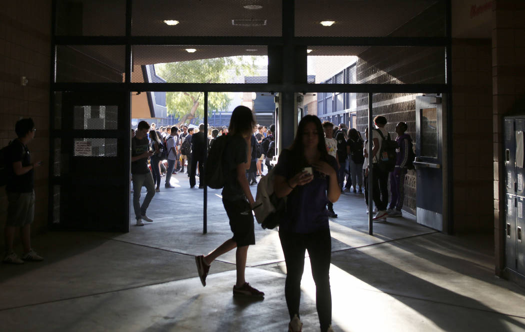 Students find their homeroom on the first day of school at Liberty High School in Henderson Mon ...