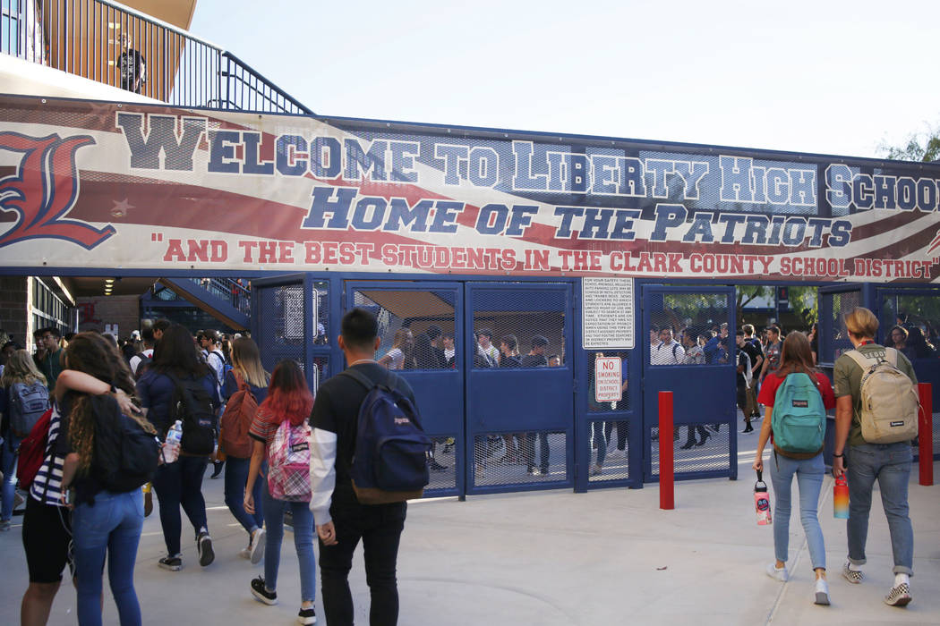 Students arrive for the first day of school at Liberty High School in Henderson Monday, Aug. 12 ...