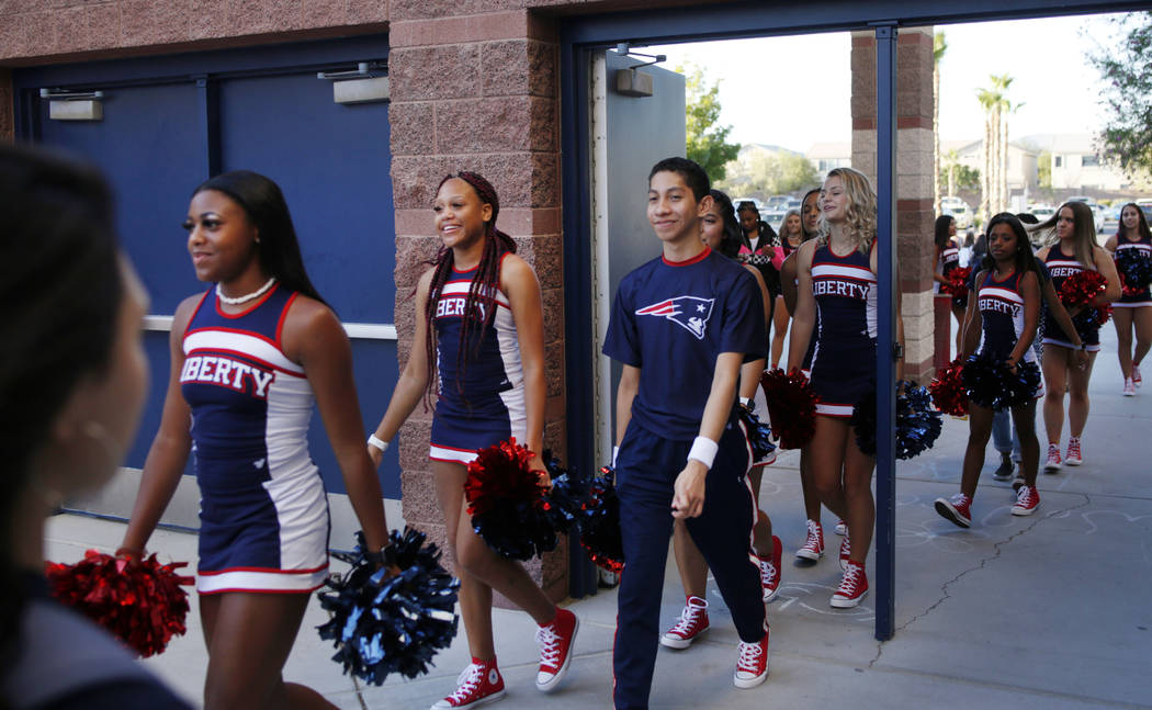 The spirit squad arrives on the first day of school at Liberty High School in Henderson Monday, ...