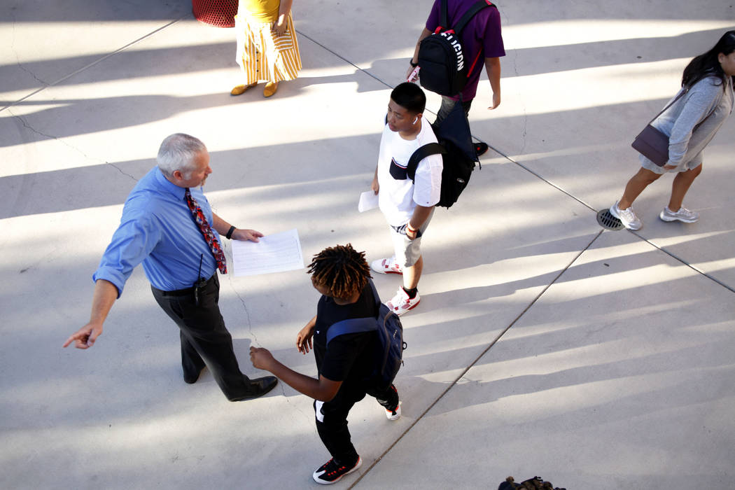 Students get directed to their homerooms on the first day of school at Liberty High School in H ...