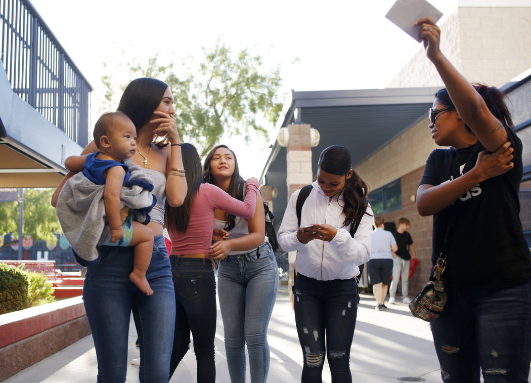 Students get directed to their homerooms on the first day of school at Liberty High School in H ...