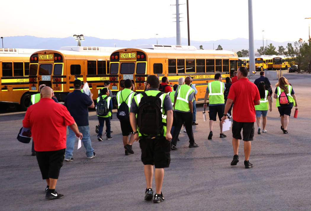 Clark County School District bus drivers arrive at the Wallace Transportation Yard in Henderson ...