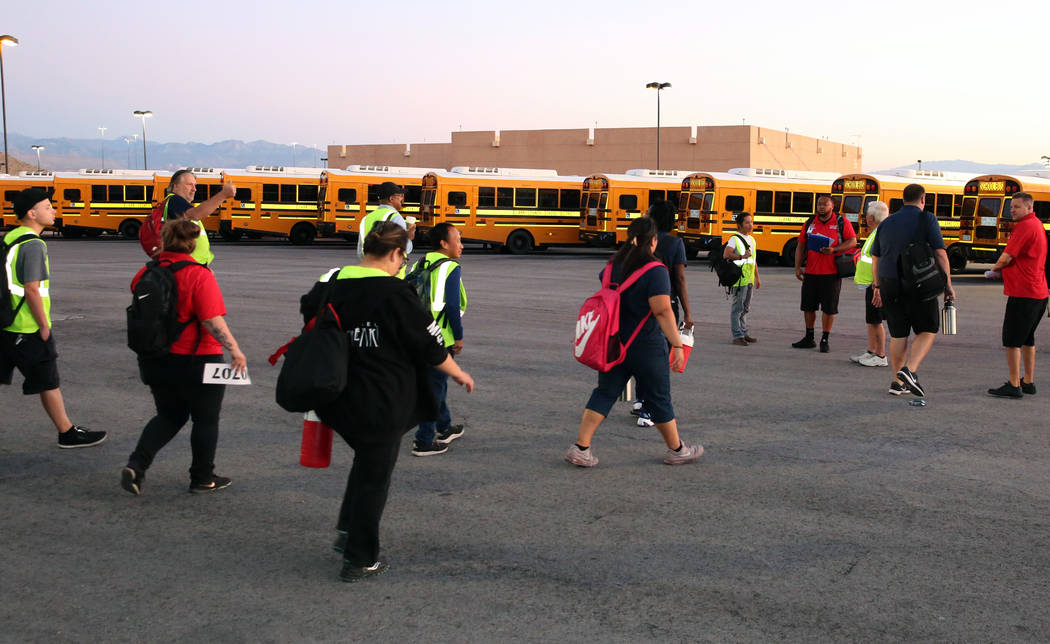 Clark County School District bus drivers arrive at the Wallace Transportation Yard in Henderson ...