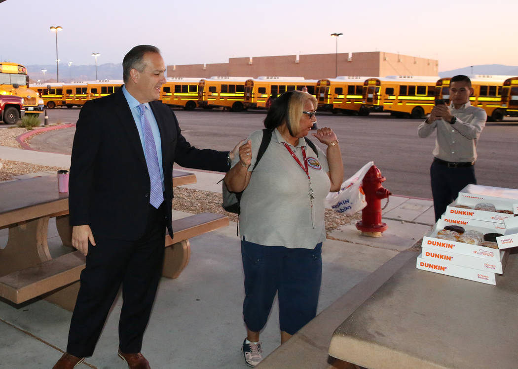 Clark County School District Superintendent Dr. Jesus F. Jara, left, offers donuts to CCSD bus ...