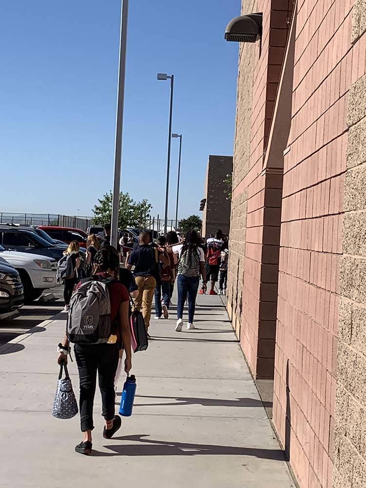 Cadwallader Middle School students head into school on the first day of classes, Monday, Aug. 1 ...