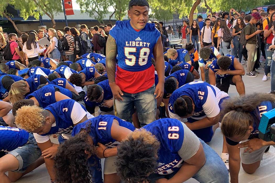 The Liberty HIgh School football team had a welcome for students returning for the 2019-20 scho ...
