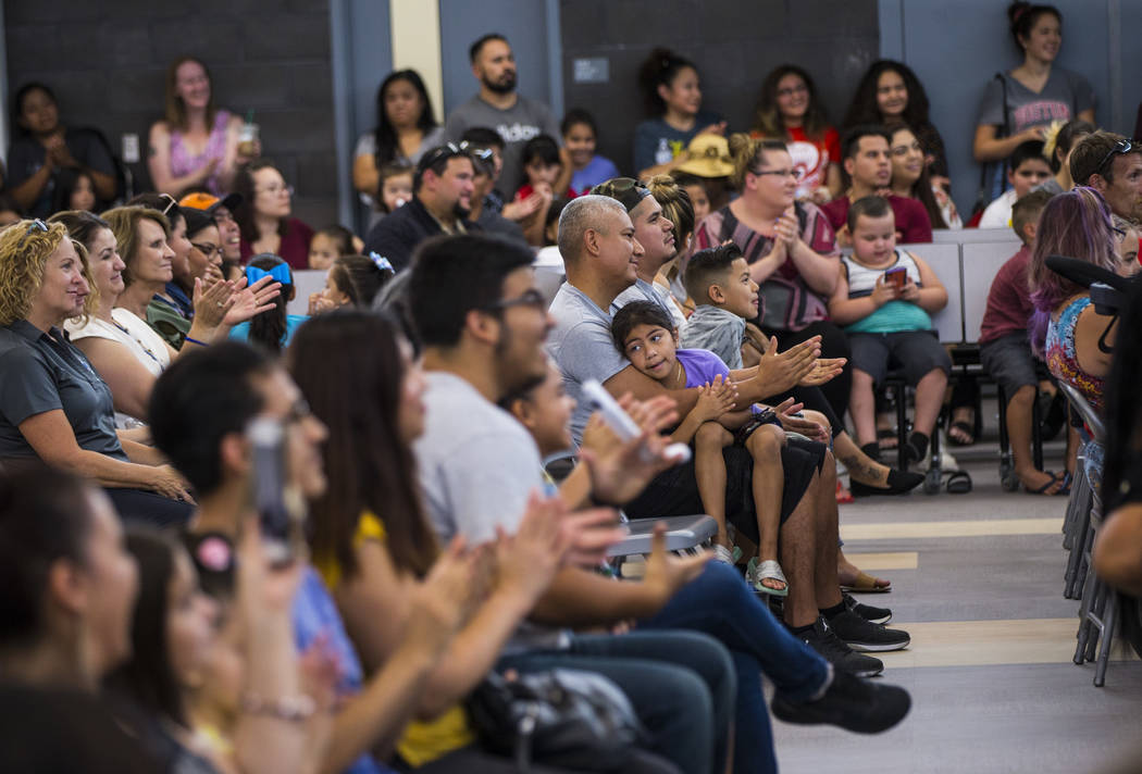 Attendees clap during a ribbon-cutting ceremony for Earl Jenkins Elementary School in east Las ...