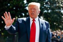 President Donald Trump talks to reporters on the South Lawn of the White House, Friday, Aug. 9, ...