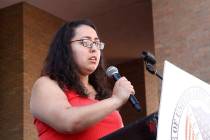 Jessica Coca Garcia stands in front of her wheelchair addressing those gathered at the League o ...
