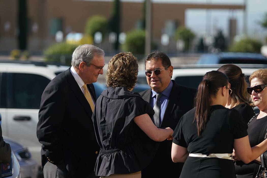 El Paso mayor Dee Margo, left, speaks to the family of Andre Anchondo, prior to the funeral ser ...