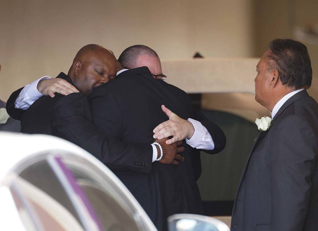 A group of mourners embrace after the funeral service for Jordan Anchondo at San Jose Funeral H ...