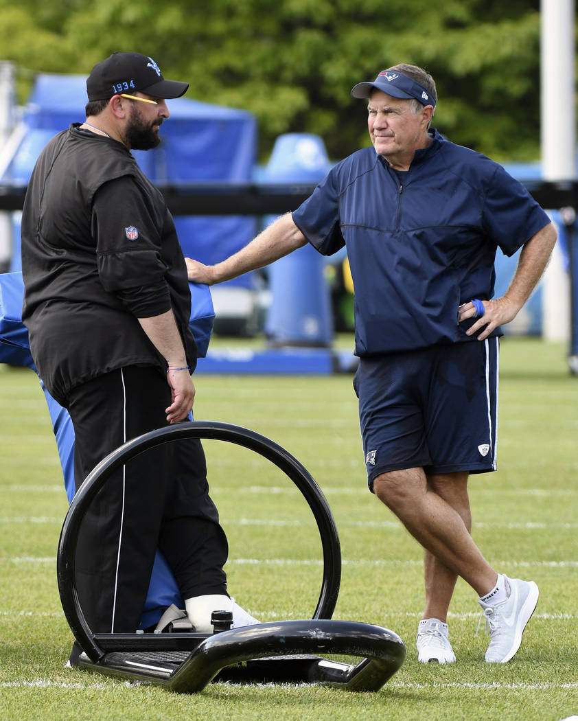 Detroit Lions head coach Matt Patricia, left, and New England Patriots head coach Bill Belichic ...
