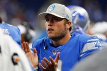Detroit Lions quarterback Matthew Stafford watches from the bench during the second half of a p ...