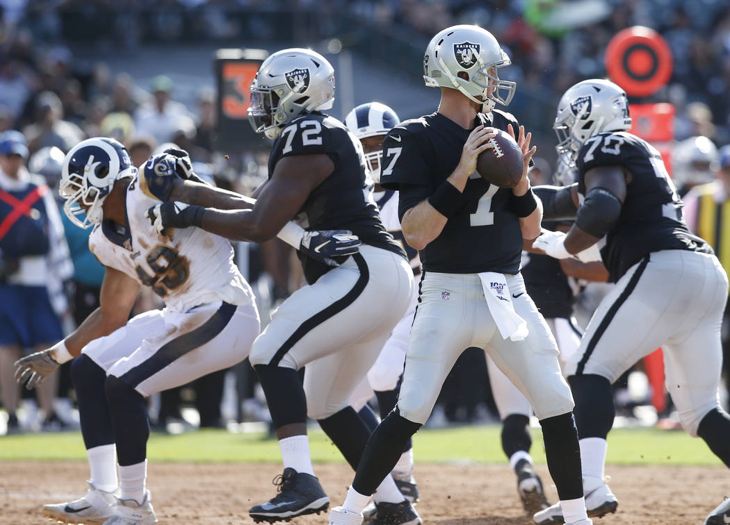 Oakland Raiders' Mike Glennon (7) looks to pass against the Los Angeles Rams during the first h ...
