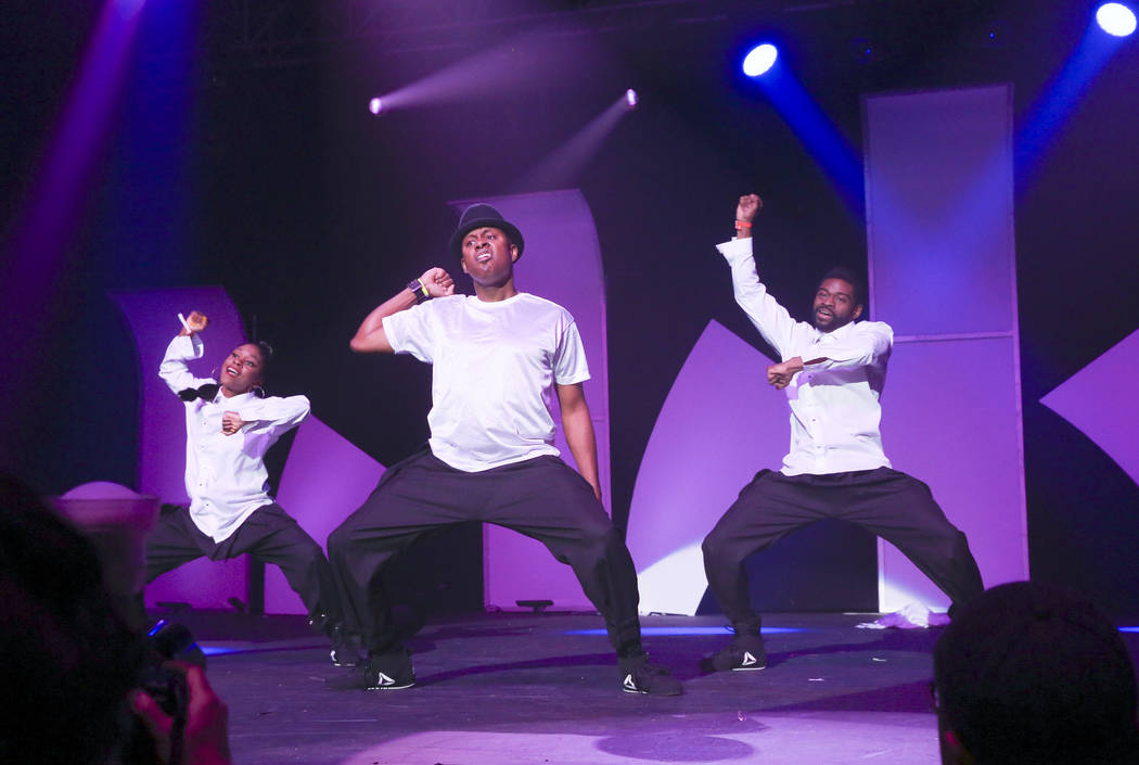 DJ Axis, center, performs with dancers during the Aid for AIDS of Nevada 33rd Annual Black &amp ...