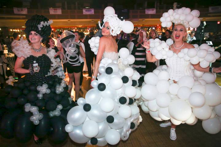 Jill Martin, from left, Amie Vreeken and Julie Lane dance during the Aid for AIDS of Nevada 33 ...