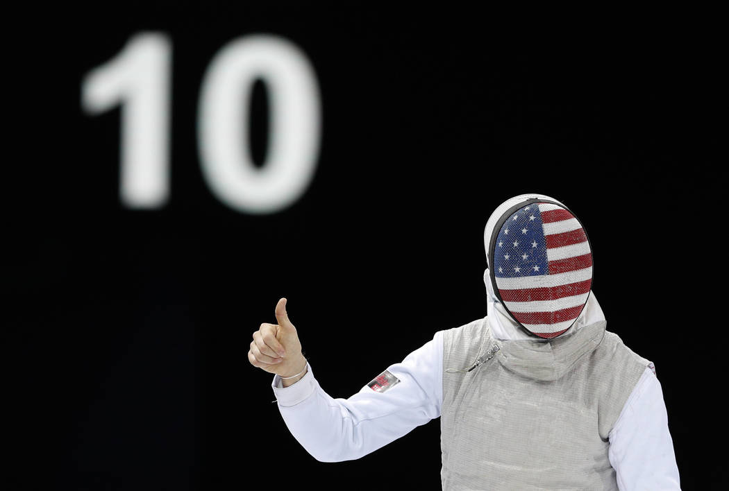 Race Imboden of the U.S. gives a thumbs up during his men's individual foil fencing semifinal m ...