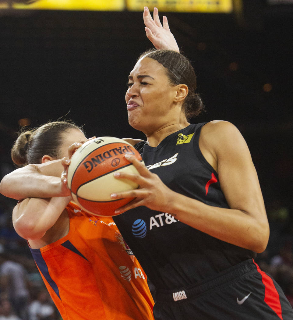 Las Vegas Aces center Liz Cambage (8) attempts a play against Connecticut Sun center Theresa Pl ...