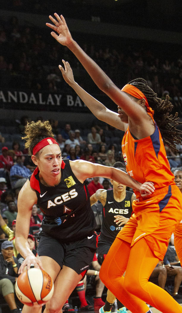 Las Vegas Aces forward Dearica Hamby (5) sets up a play against Connecticut Sun forward/center ...