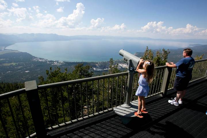 FILE - In this Aug. 8, 2017, file photo, Lilyana Allen, of Guam, uses a telescope to view Lake ...
